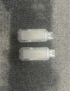 Lampki podświetlenia drzwi Audi A6 C6- 2 sztuki przód, oryginalne