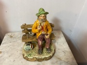 Figurka starca z fajka