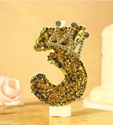 Złote błyszczące świece dekoracyjne 