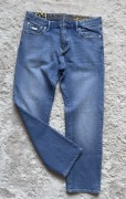 Jeansowe spodnie męski Superdry błękitne wygodne 33/32 roz M/L stan bdb 