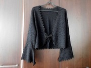 Eleganckie jak nowe czarne bolerko 42