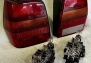Oryginalne lampy tylne + gniazda żarówek L+P GEMO VW Polo II 86C 90-94