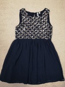 Granatowa elegancka zwiewna sukienka w cekiny syrenka Friboo 134 - 140