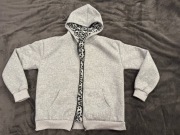 Bluza zapinana na zamek z podszewką w panterkę. Rozmiar M. Nowa