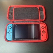 Nintendo Switch – świetny stan + DUŻE etui + 2 gry + akcesoria