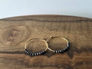 Złote kolczyki z spinelem