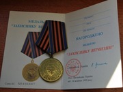 Medal Odznaczenia Obrońcy Ojczyzny + legitymacja nr.038