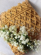 Ozdobna duża poduszka ze sznurka makrama