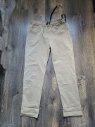 Beżowe spodnie damskie 42