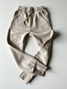 Reserved beżowe spodnie dresowe r. 146cm