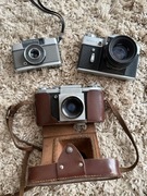 Zestaw aparatów vintage: Praktica Zenit-E Olympus Pen EE z futerałami