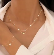 Naszyjnik typu celebrytka z zawieszką serce i perełkami + bransoletka