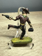 Żołnierzyk PRL Kowboj z rewolwerem i torba. 