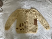 Sweterek  kolor masełkowy ręcznie robiony na drutach dla dziewczynki