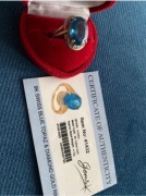 Złoty pierścionek z topazem i diamentami