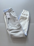 Nike spodnie dresowe Sportswear Fleece DV8193133 XS białe szare nogawki