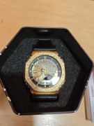 Casio G-Shock GM-2100MG-1AER Midnight Gold komplet