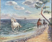 Konie galopujące wzdłuż brzegu morza