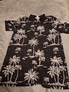 Stylowa koszulka polo z tropikalnym wzorem #S#