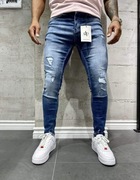 Nowe jeansy męskie z przetarciami 31/32