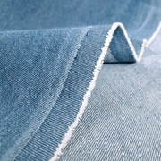 Jeans bawełniany niebieski dekatyzowany błękitny tkanina