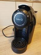 Ekspres do kawy Delta Q z funkcją spieniania mleka.