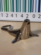 Otwieracz metalowy z funkcją zapalniczki foka unikat vintage 