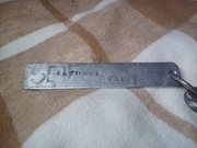 Stary brelok metalowy do kluczy z zakładu pracy PRL 