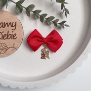 Czerwona kokardka z aniołkiem