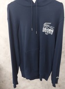 Lacoste bluza bawełniana kolor granatowy z kapturem z nadrukiem