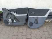 Toyota Yaris 2 zamek drzwi ,szyby uszczelki tapicerka klamki str R 