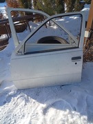 Drzwi kpl szyba zamek klamka OPEL Kadett E 84-91 białe przód lewe ZDROWE