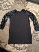 Next bluzka z cekinami na rękawach r. 146