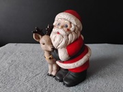 Figurka Świętego Mikołaja (Santa Claus) tulącego renifera. Scioto