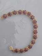 Złota branzoletka z granatami