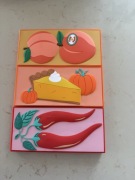 trzy palety cieni do powiek z serii Tasty marki I Heart Revolution