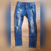 Spodnie z przetarciami dsquared2.