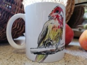 Kubek z kolorowymi papugami 