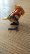 Nakręcana metalowa papuga zabawka PRL