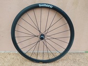 KOŁO GRAVEL SHIMANO WH-RX31 SM-CXRIM 100x12mm CARBON 