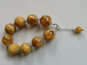 Bransoletka z bursztynem kule srebro 