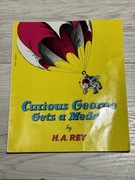 Curious George gets a medal wydanie 1957