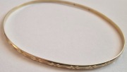 Zlota bransoletka sztywna pr 585 waga 3.35 g,średnica 7cm.