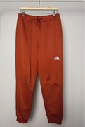 Dresy spodnie dresowe męskie The north face pomarańczowe rude M L sportowe
