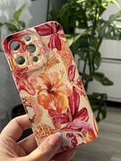 Kremowy case iPhone 13 Pro etui w pomarańczowe i różowe kwiaty kwiatki