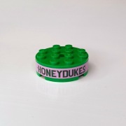 87081pb004 Okrągły klocek 4 x 4 z napisem HONEYDUKES [2A1]