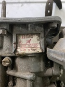 Pozostałości łada, gaźnik, korba, torba po 50 zł