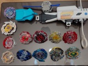Duży zestaw Beyblade Burst x 8 + wyrzutnie + grip i części