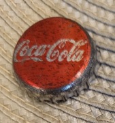 Kapsel Coca-Cola butelkowane