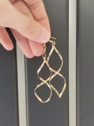 Kolczyki damskie złote spiralne wiszące eleganckie glamour